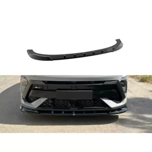 This composite image includes three parts: a standalone view of the gloss black front splitter, a full frontal shot of it installed on the car, and a focus on how it integrates into the bumper design. The splitter is a curved accessory designed to mount directly beneath the front bumper. It has a shiny finish and molded lines that align with the vehicle’s shape, creating a clean and aggressive look. The frontal view highlights how the splitter sits snugly across the bumper’s lower edge, giving the vehicle a lowered, racing-inspired appearance while potentially offering aerodynamic benefits.