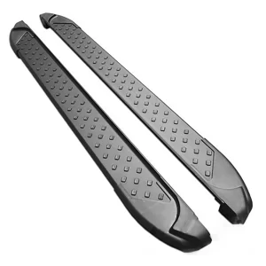 A pair of matching black side steps is laid out on a plain white surface. Each step is long, narrow, and features a slightly contoured end with a rounded tip. Along the length of the stepping surface are small, evenly spaced rectangular grips. These grips are raised and likely rubber-coated, providing safe footing. The ends are designed to align smoothly with the vehicle’s frame.