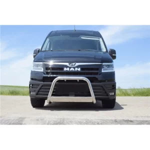 A black MAN TGE van is shown from the front, parked on an open road with a clear sky and grassy landscape in the background. Mounted on the lower front bumper is a 63mm stainless steel bull bar with a simple and clean U-shaped design. The bar curves around the center of the bumper and connects to mounting points beneath the vehicle. It has a polished, reflective finish that contrasts with the matte black grille and bodywork. The design is minimalistic—featuring a single crossbar without lights or embellishments—serving primarily as a protective and styling element for urban or light commercial use.