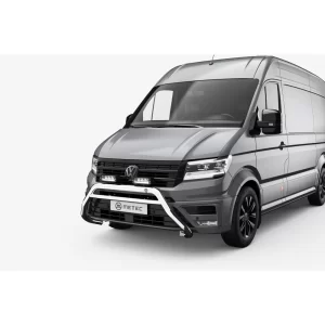 This image shows the bull bar fully installed on the front of a grey MAN TGE van. Mounted low on the front bumper, the polished stainless steel bull bar wraps protectively around the license plate area and houses two LED driving lights on the horizontal top bar. The installation appears precise, complementing the van’s design. The bull bar adds rugged, commercial-style protection while giving the vehicle a more commanding and ready-for-work appearance.
