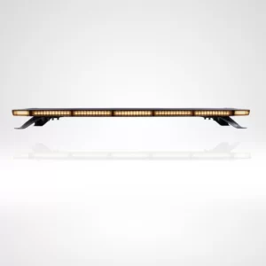 Amber LED lightbar captured from a frontal angle with all lights on. The bar produces a continuous line of amber light, cleanly segmented across its width. It is installed on four black brackets that raise it gently above a glossy white surface, casting a subtle reflection. The design is streamlined and modern, suitable for commercial or emergency vehicle use.