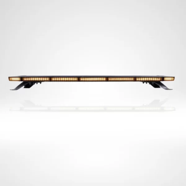 Amber LED lightbar captured from a frontal angle with all lights on. The bar produces a continuous line of amber light, cleanly segmented across its width. It is installed on four black brackets that raise it gently above a glossy white surface, casting a subtle reflection. The design is streamlined and modern, suitable for commercial or emergency vehicle use.