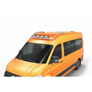 An orange MAN TGE van is shown from a high front-side angle, emphasizing the roof area. Mounted across the front of the roof is a stainless steel roof bar with a 60mm tubular diameter. The bar curves smoothly along the contour of the roofline and is equipped with four integrated LED spotlights facing forward. The polished metal finish contrasts with the vibrant orange bodywork, giving the van a rugged, utility-focused appearance. This roof bar serves both aesthetic and functional purposes, enhancing visibility in dark or off-road conditions while providing a solid mounting point for additional equipment.